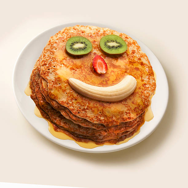 Freshly made pancakes making a fun face.