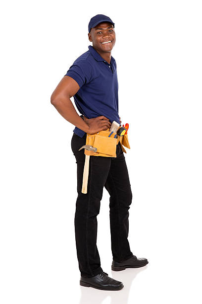 junge afrikanische mann - construction worker building contractor craftsperson full length stock-fotos und bilder