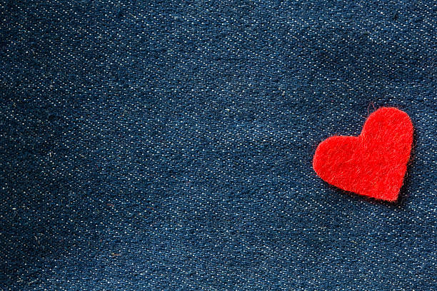 istock Valentines Day background with Red hearts on jeans background 506878432