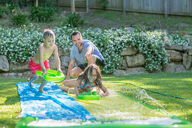 istock Family having fun with water 506878902