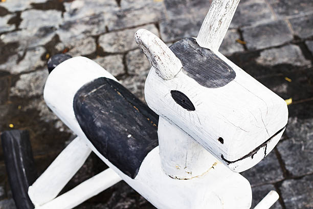 Handmade rocking horse chair at the child play ground, focus at head