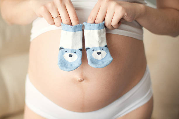 istock pregnant woman waiting for a  boy 506880862