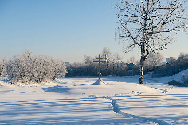 Orthodox cross in the snow stock photo