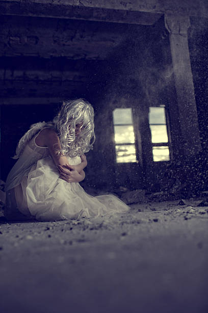 istock Sullen angel in a ruin. 506881144