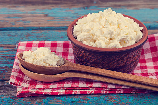 istock Fresh cottage cheese in a ceramic dish and spoon 506882842
