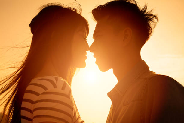 istock Smiling Couple in love with sunlight background 506883432