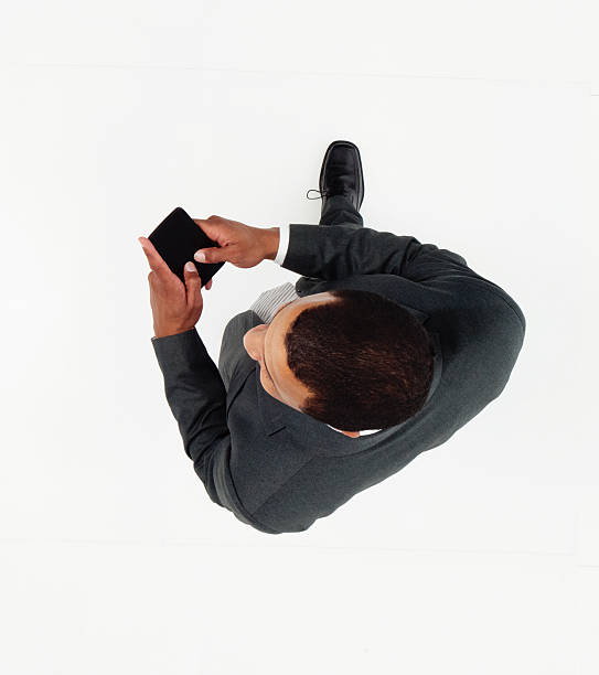 istock Above view of businessman using phone 506883600
