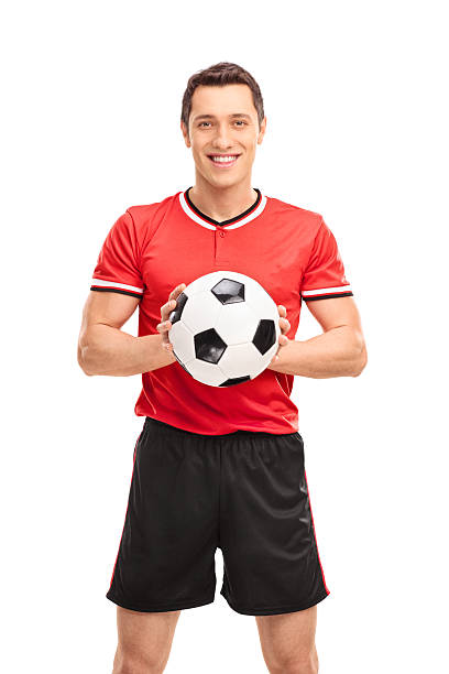 istock Young football player holding a ball 506884680