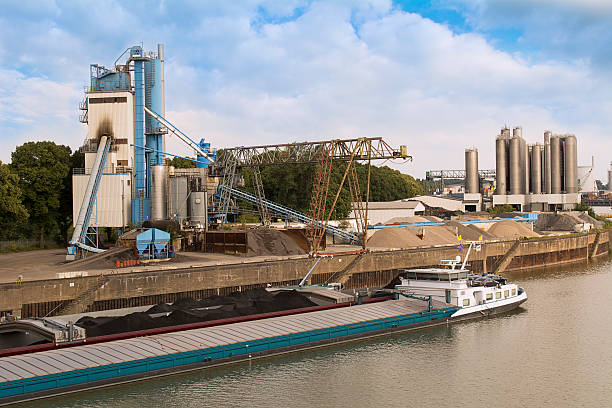 istock Cargo ship in the river Rhine an industrial buildings 506884821