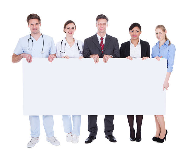 istock Doctors And Businesspeople With Billboard 506884921