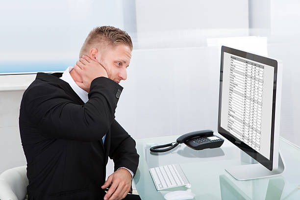 istock Businessman studying an online spreadsheet 506885865