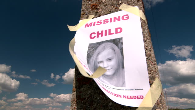 Missing person poster with photo of child