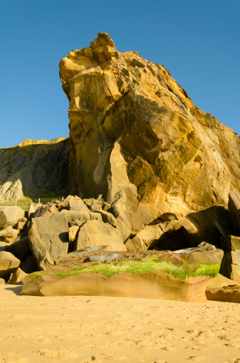 Yellow beach cliff in Santa Cruz Portugal.