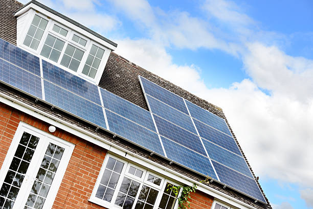 istock House with Solar Panels on the Roof 506889639