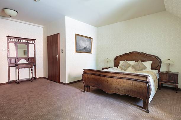 istock Cream and brown bedroom interior 506889744