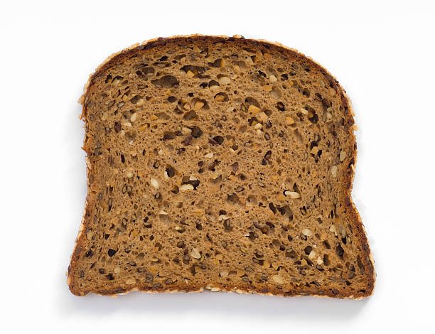 istock slice of wheat bread Rye Bread with butter isolated 506889790