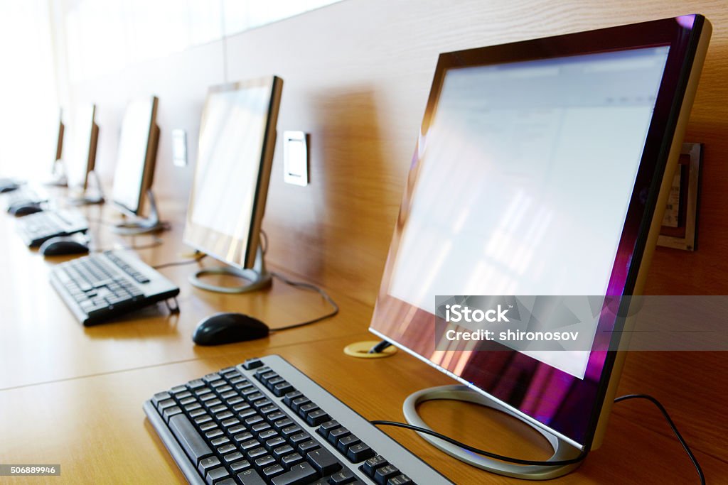 Computer classroom Photo of row of computers in classroom of college or other educational institution Computer Stock Photo