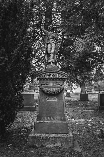 istock Tombstone and graves in graveyard landscape 506890718
