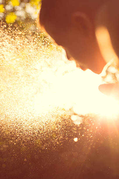 istock Boy splashing with water in garden 506890814