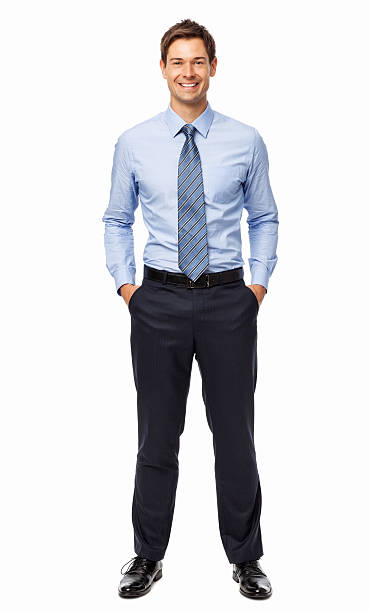 istock Smiling Businessman Standing With Hands In Pockets 506891105
