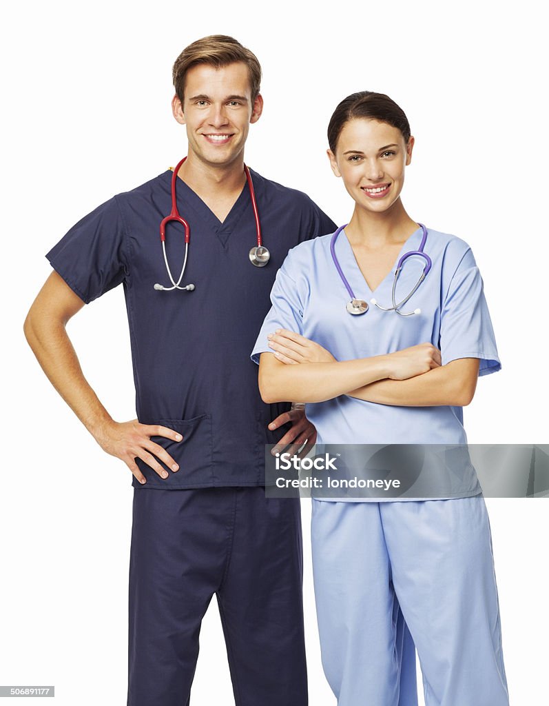 Portrait Of Male And Female Doctors With Stethoscopes Portrait of smiling male and female surgeons with stethoscopes standing against white background. Vertical shot. Males Stock Photo