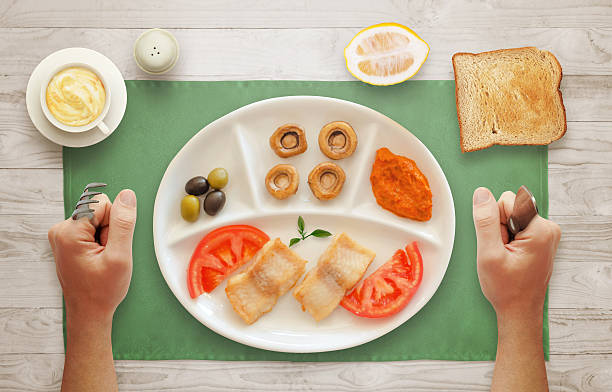 istock Served breakfast. Fish, tomato, cheese, mushroom, lemon 506892992