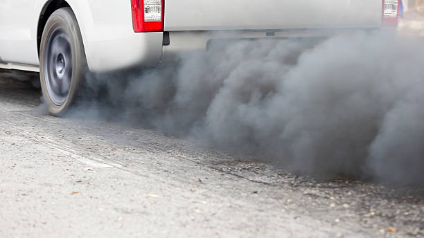 istock Air pollution from vehicle exhaust pipe on road 506895060