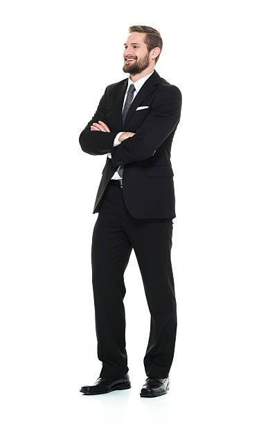 istock Smiling businessman standing with arms crossed 506895664