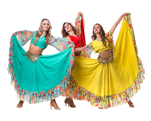 istock three female dancers posing, isolated on white in full length 506896930