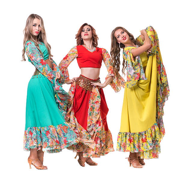 istock three female dancers posing, isolated on white in full length 506897034