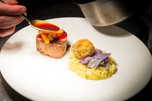 istock Fillet steak, risotto, braised beef bon bon, carrots & jus 506897134