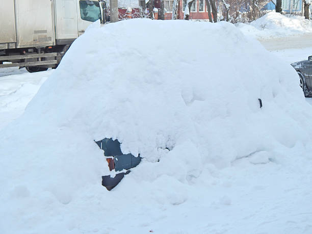 istock car covered with snow in the snow 506897592