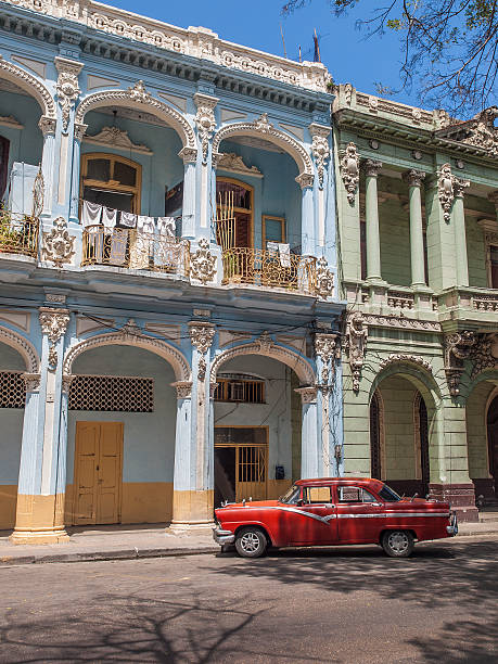 istock old american car parked in front of house 506897846