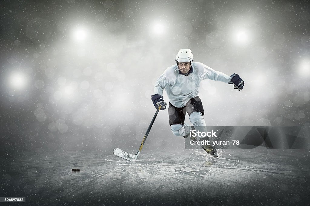 Ice hockey player on the ice, outdoors Hockey Stock Photo