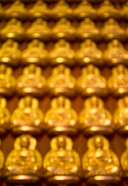 abstract blur focus image buddha on wall stock photo