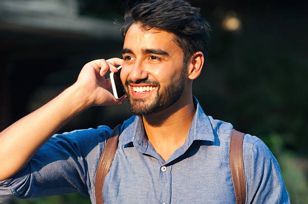 istock Handsome Indian man talking on phone 506899726