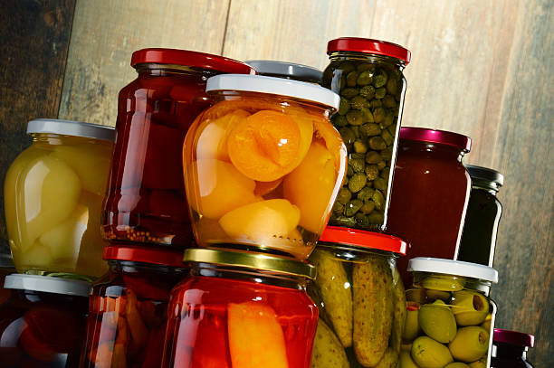 istock Jars with pickled vegetables, fruity compotes and jams 506899998