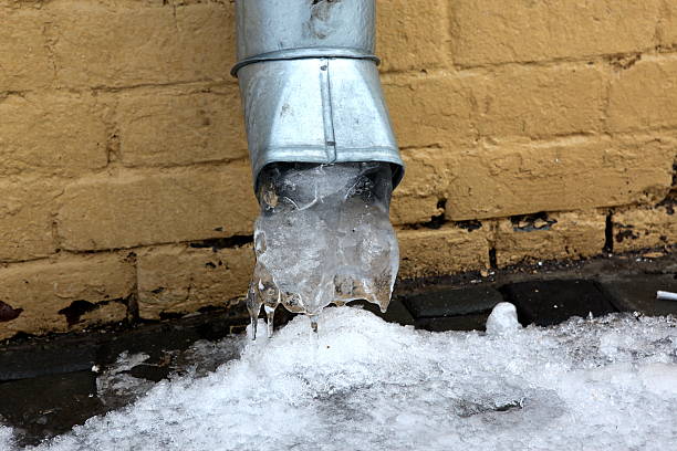 istock icicles which are frozen down from a water tube 506900904