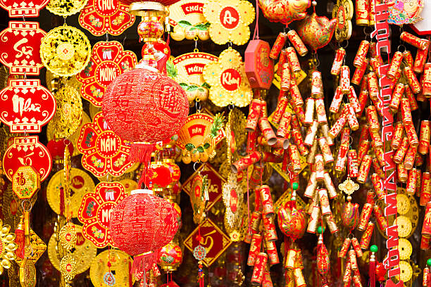 Red Chinese New Year decorations to celebrate the lunar new year of Tet in a market in the Cholon area of Ho Chi Minh City, Vietnam.