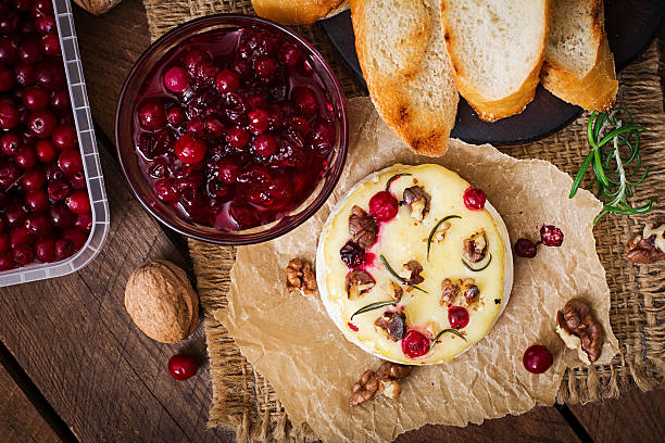 istock Baked cheese Camembert with cranberries and nuts. Top view 506902250