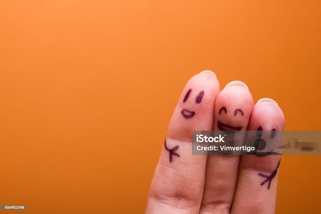 three smiling fingers that are very happy to be friends three smiling fingers that are very happy to be friends, family concept Friendship Stock Photo