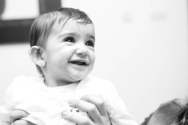 istock Little baby with a big smile. Black and white 506902420