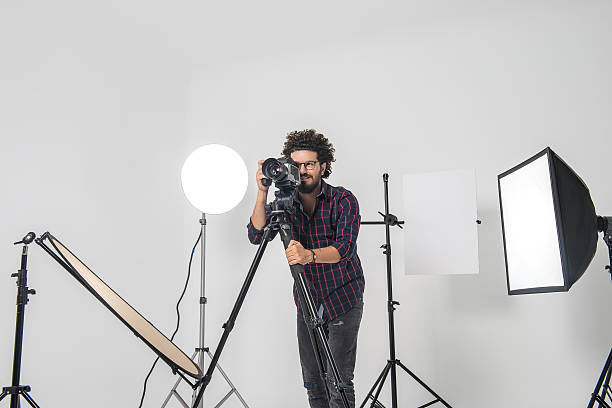 istock Portrait of smiling photographer with medium format camera 506902804