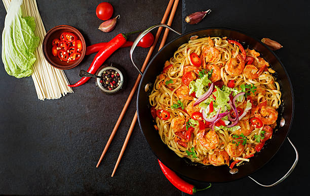 istock Udon pasta with shrimp, tomatoes and paprika. Top view 506902952