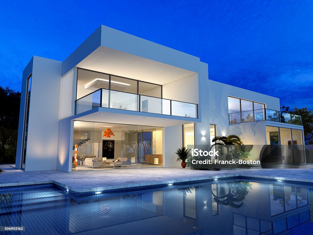 Luxurious villa with pool luxurious villa with swimming pool at dusk House Stock Photo
