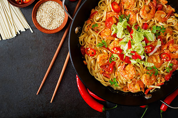 istock Udon pasta with shrimp, tomatoes and paprika. Top view 506903184