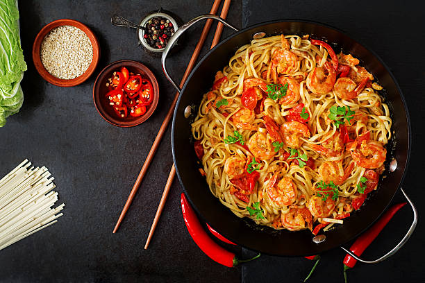 istock Udon pasta with shrimp, tomatoes and paprika. Top view 506903596