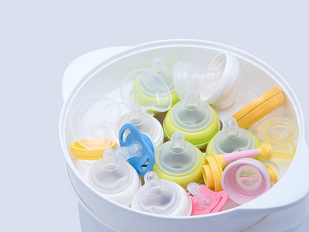 istock Nipples in steam sterilizer and dryer. 506903758