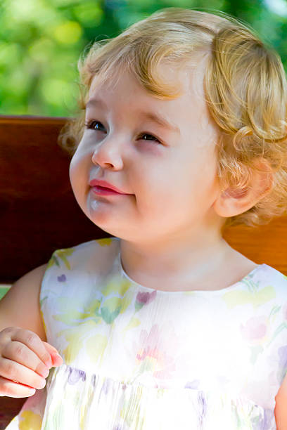 istock Cute infant with curly blond hair 506905330