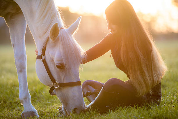 istock Young woman with horse 506906426